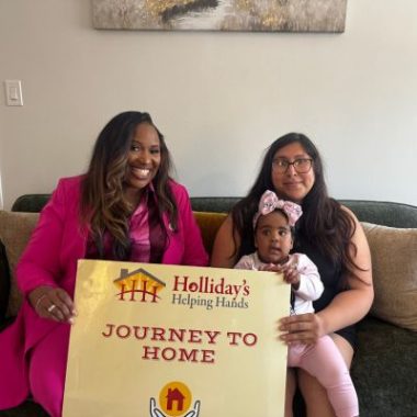 Jessica Avalos holding her daughter in new Venice home
